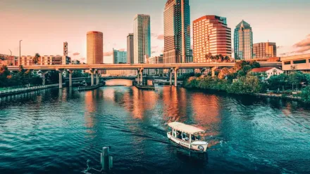 An electric boat cruising the Tampa Riverwalk